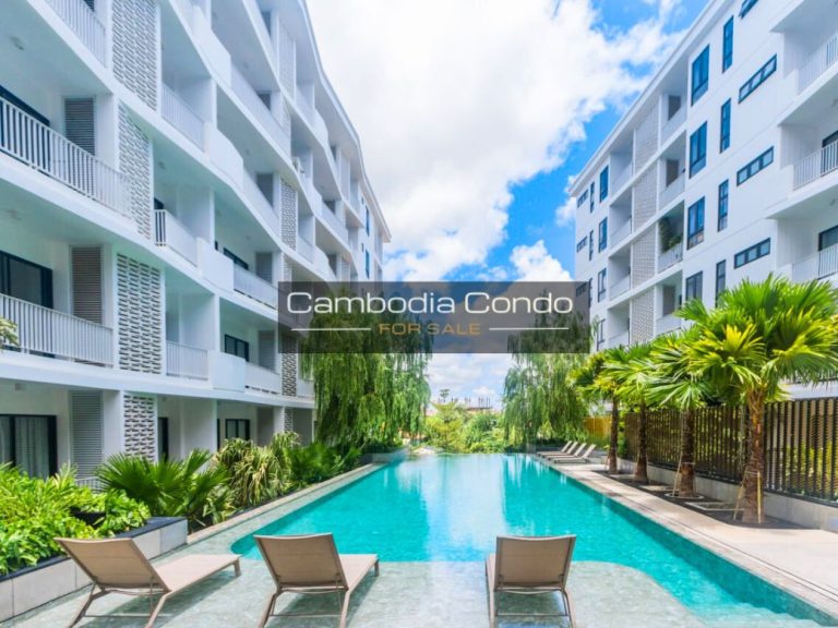 Rose Apple Square Condo - Exterior shot showing wheelchair accessible entrance, landscaped gardens, and welcoming design